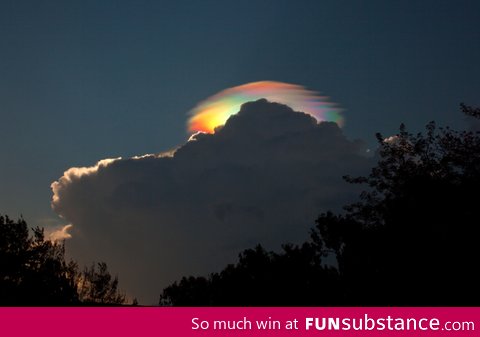 An extremely rare rainbow-colored pileus iridescent cloud over Ethiopia