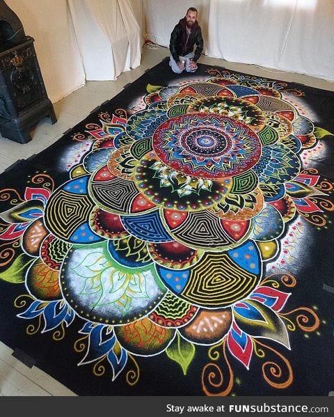 Huge mandala made completely out of coloured sand