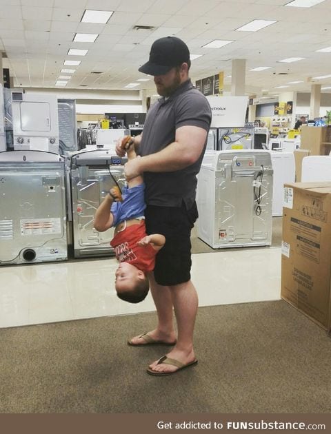 What fatherhood looks like. Putting a shoe on a 2yo