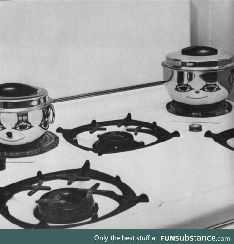 Reflection of burners on the pots looks like they're smiling
