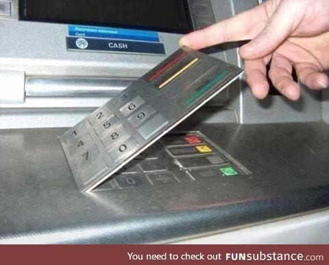 This is an ATM pin code skimmer. Sneaky bastards