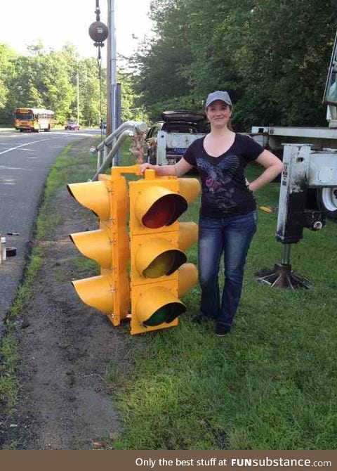 You never realize how big a traffic light is until you see one next to a person