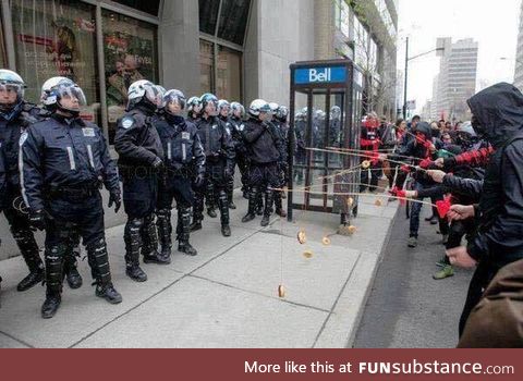 Montreal students protesters baiting riot police with donuts