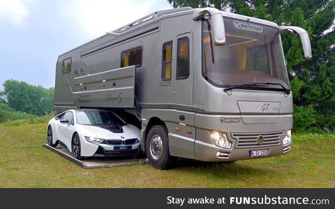 This $1.7 million motor home with its own garage may look like an ordinary bus until...