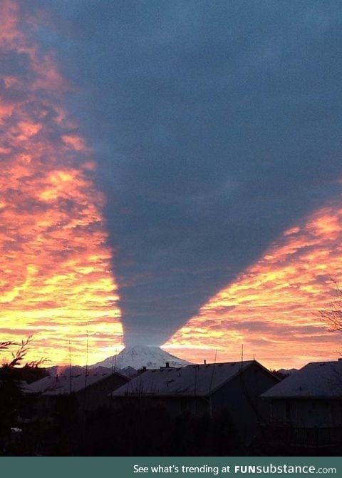 Mt. Rainier casting a shadow during a sunset