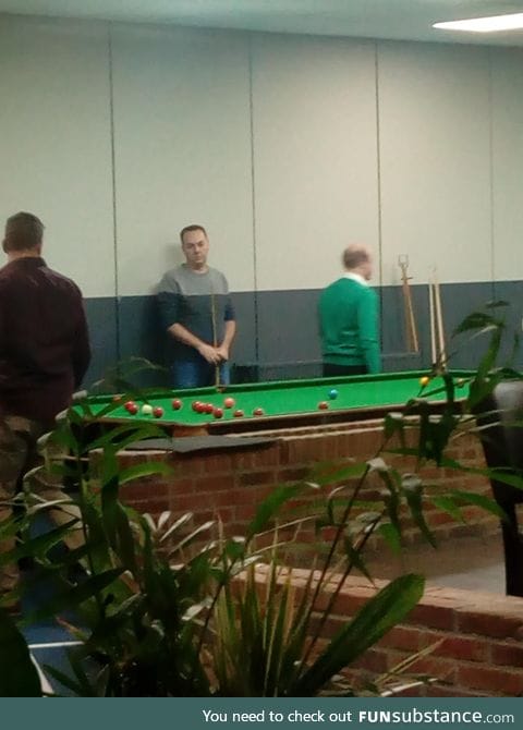 This guys sweater lines up with the wall