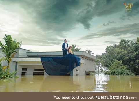 This couple decide that the flood ain't gonna stop their wedding