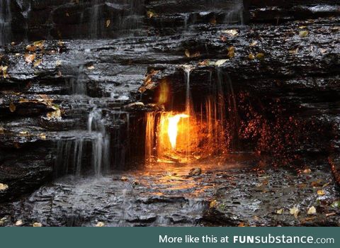 ‘Eternal Flame Falls’ a natural gas jet behind the waterfall burns perpetually