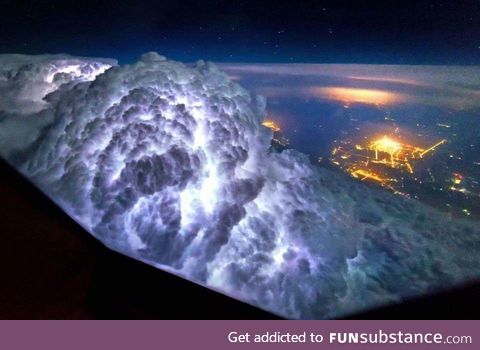 Looking down on a thunderstorm from above the clouds