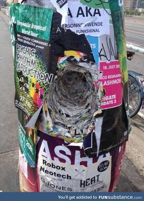 The layers of posters on this telephone pole after years of people hanging them there