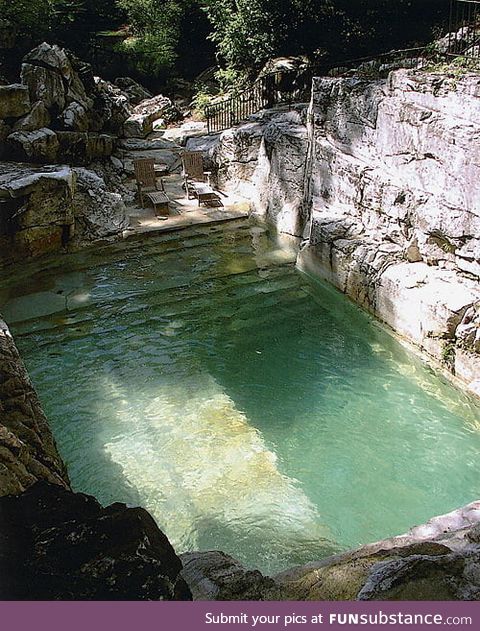 Backyard pool built into the existing limestone quarry