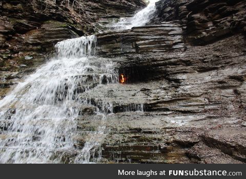 Eternal Flame Falls. A naturally occurring flame burns inside the heart of this waterfall