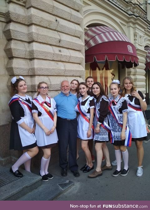 Harold surrounded by Russian schoolgirls