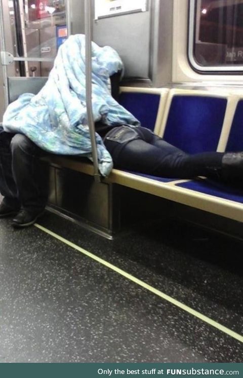 Caring boyfriend helps girlfriend to sleep on a train