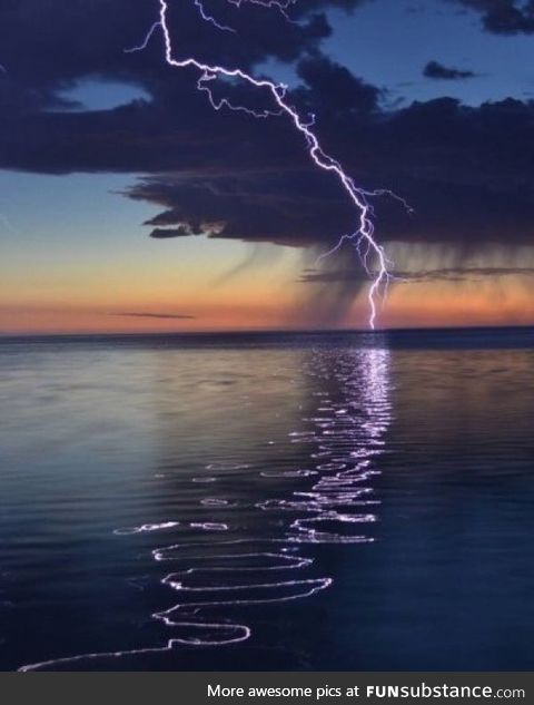 The rippling reflection of this lightning strike