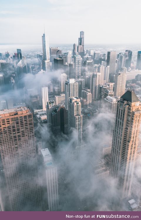 Chicago covered in clouds from 95 stories up.