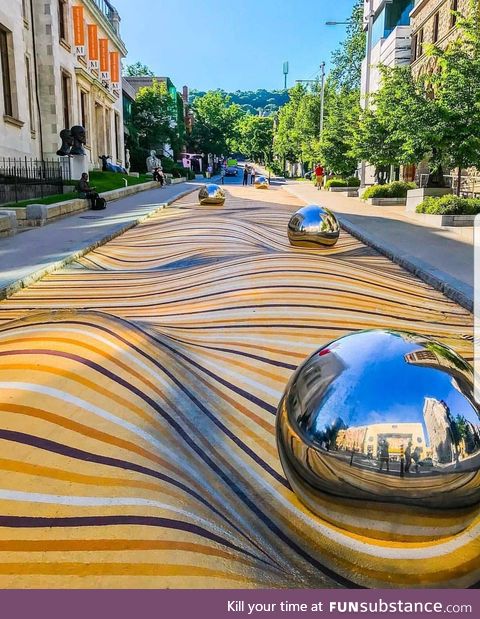 Optical illusion painted on a street near the Montreal Museum of Fine Arts