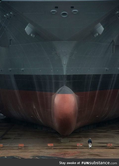 The USS Gerald R Ford in drydock, human for scale