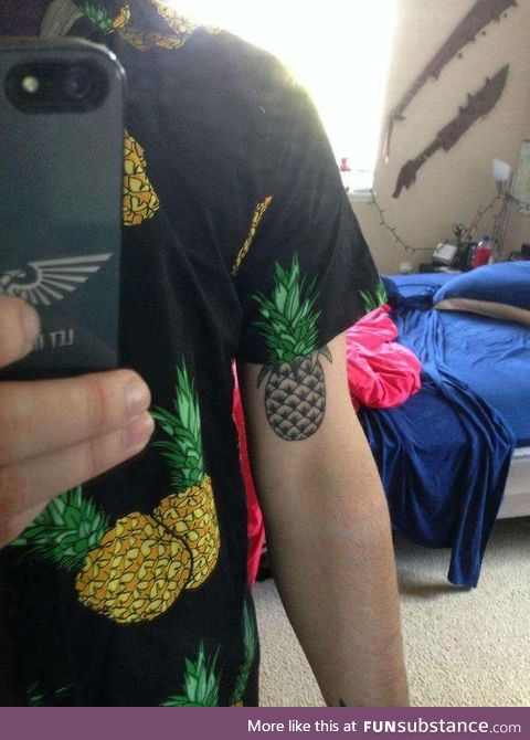 The way the tattoo lines up with the shirt