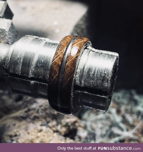 This ring is being made from a Jack Daniels Whiskey barrel and a worn guitar string inlay