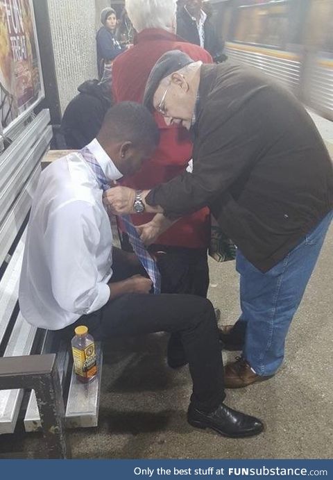 Old man noticed a stranger was having trouble with his tie, and offered to help