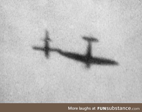 A supermarine spitfire using the tip of it's wing to nudge a V-1 rocket off course