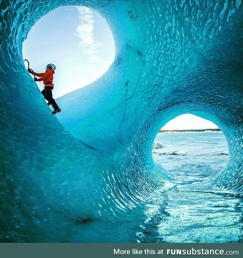 Ice cave carved out by water moving through a glacier