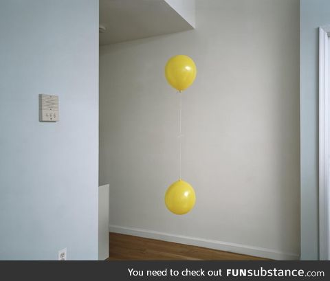 Helium filled balloon and non helium filled balloon appears to be stuck in the same spot
