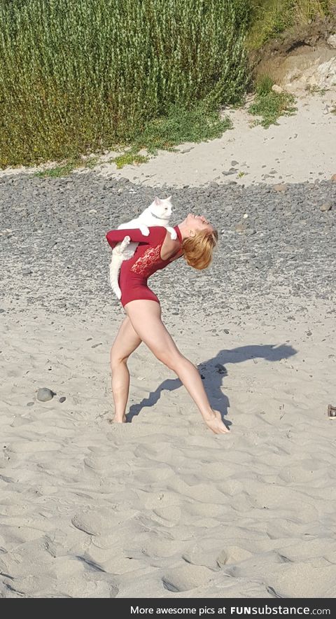 We took my cat to the beach and there happened to be a professional dancer having a photo