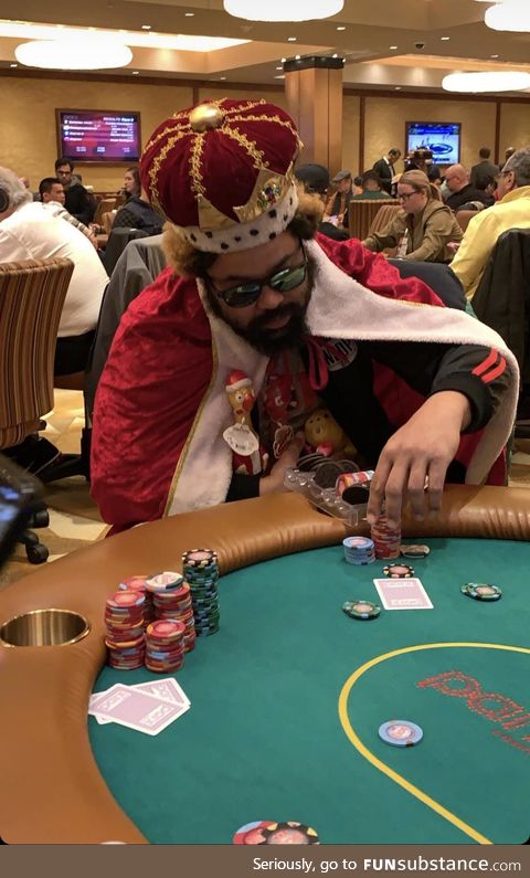 This guy dressed as the Burger King at a poker table with Oreos in his chip holder