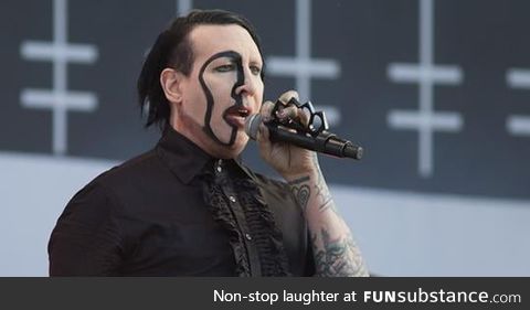 Marilyn Manson looks like Nicholas Cage dressed up as Marilyn Manson