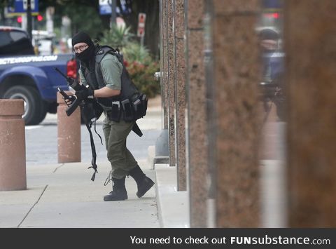 A Dallas Morning News photographer took this picture of an armed gunman shortly before