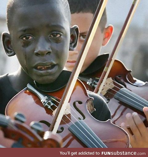 Diego Fraz&atilde;O Torquato, 12 year old Brazilian playing the violin at his