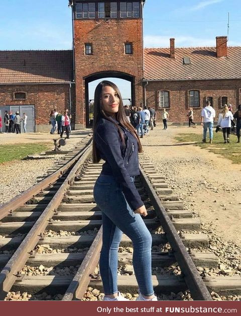 Imagine visiting Auschwitz and making it your priority to take a photo with your ass