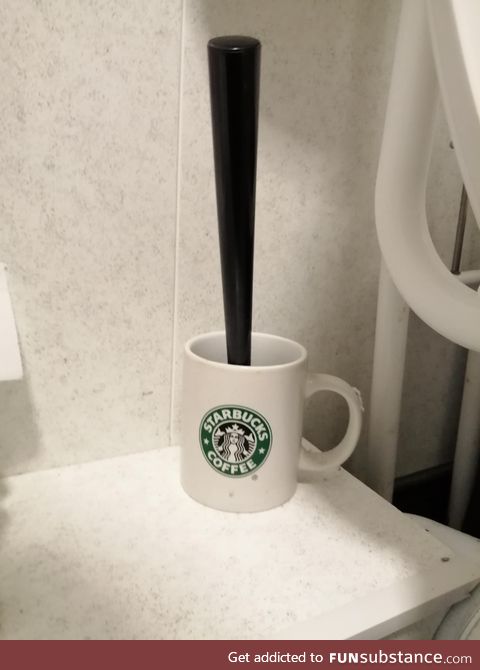 Toilet brush holder in an independent coffee shop