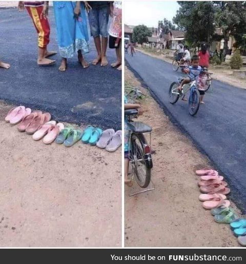 Indonesian residents walk barefoot because they do not want to get new asphalt dirty