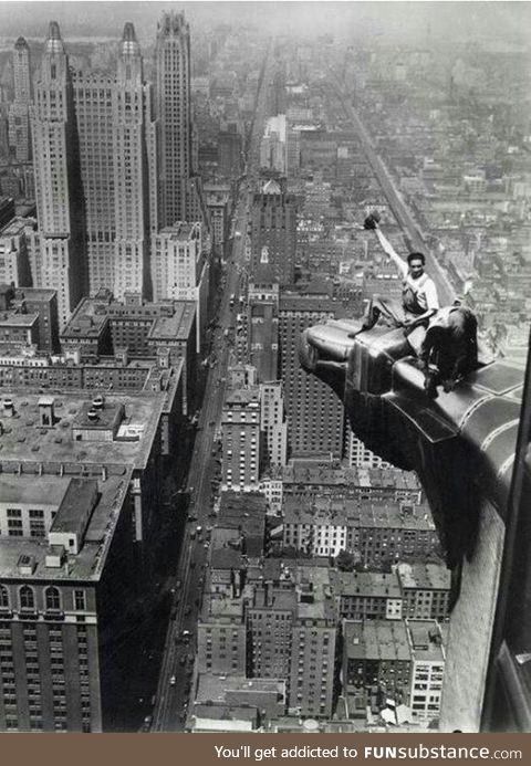 Aug 8 1932... two workers clean the eagle ornamentation on The Chrysler Building in NYC.