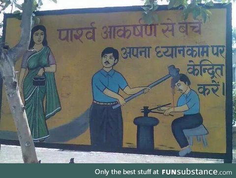 PSA signboard in India. It says, ‘Avoid distractions and focus on your work.’