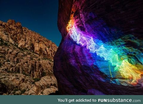 This rainbow path I created by taking a long exposure photpograph of myslef rock climbing