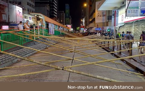 Protesters in HK set up bamboo road blocks