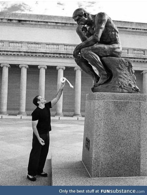 This photo of Robin Williams offering toilet paper to the "thinker" statue