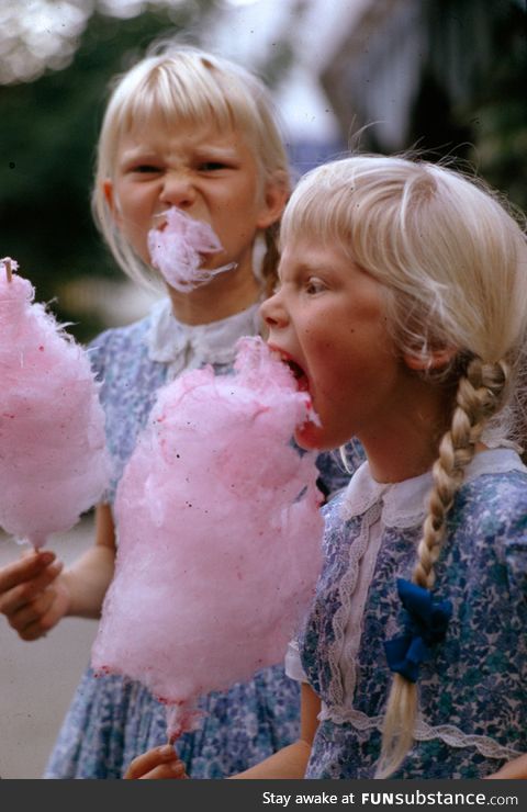 Girls eat cotton candy in Denmark, 1963