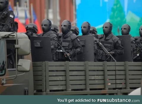 Taiwan Special Forces with bullet proof face masks look like they take sample c-19 pretty
