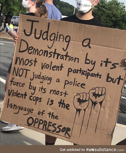Sign from a protest in Charlotte, NC explaining double standards at play. Shot by