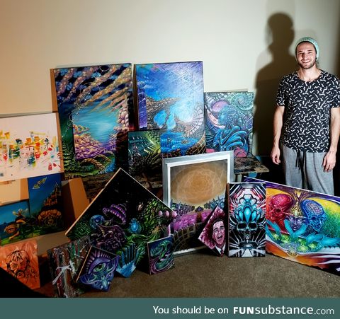 Heres me posing with most of my quarantine paintings, back to the ole 9 to 5