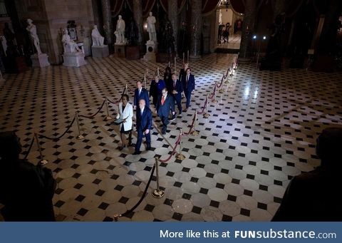 House managers chosen by Speaker Nancy Pelosi walk across Capitol Hill to deliver the