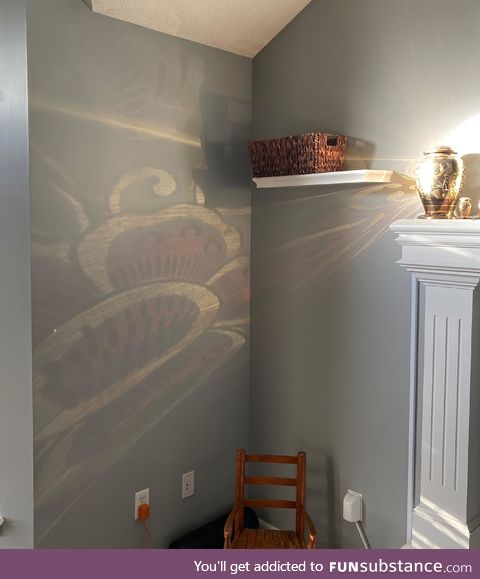 Every morning the sun hits my mom's urn and reflects on the wall in this pretty design