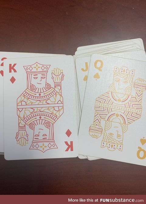 McDonald's themed deck has the queen holding the burger... For reasons