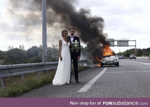Newley wedded in front of their burning car