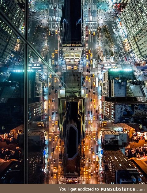 I looked over the edge of a building in NYC and saw this crazy reflection [OC]